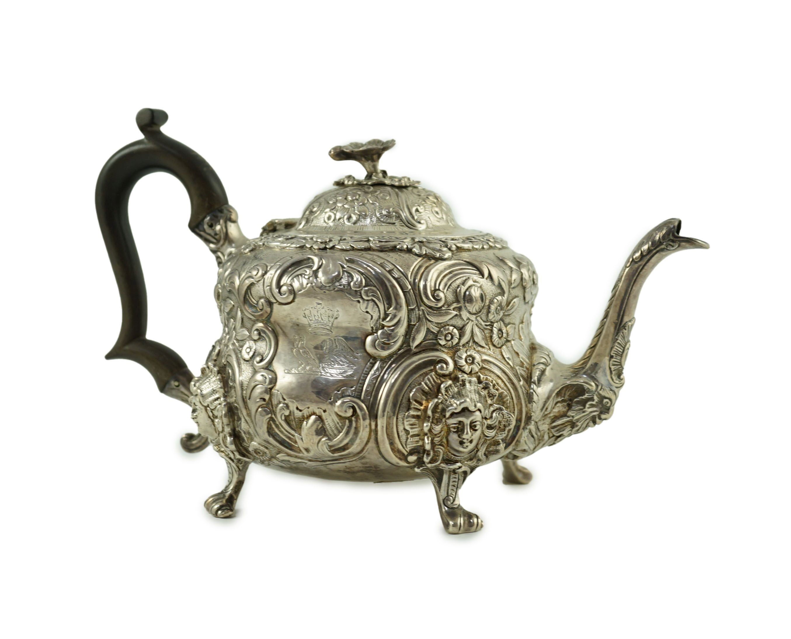 An early Victorian embossed silver teapot, by William Moulson